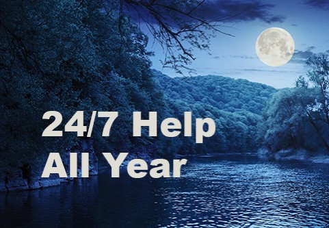 24/7 Help All Year.  A night scene with a full moon shining on a river surrounded by forest.